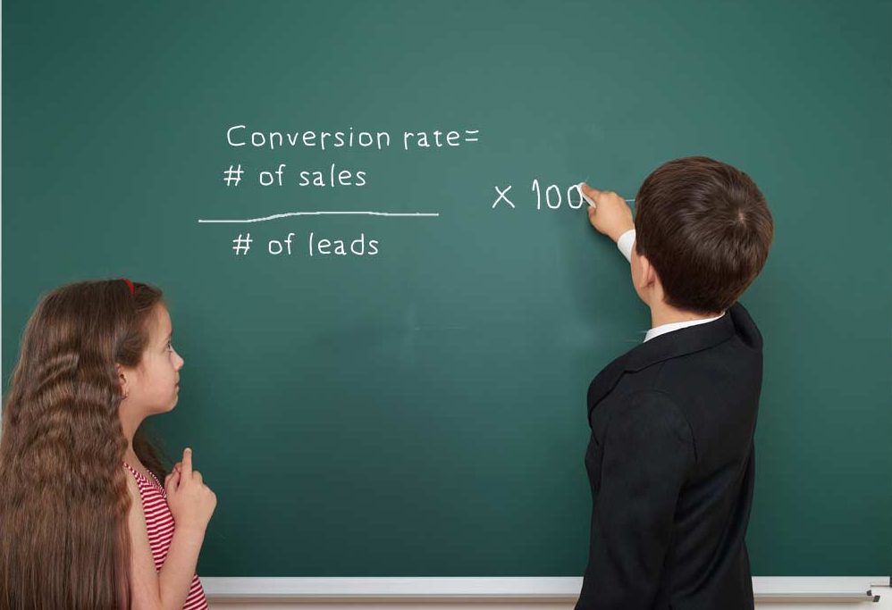 To young students working out the conversion equation on a blackboard.